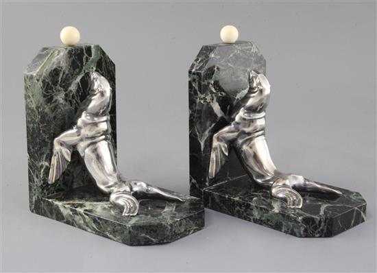 Maurice Frecourt. A pair of Art Deco silvered spelter marble and ivory bookends, 7.5in.